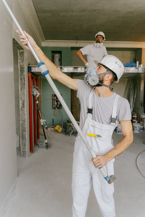 Construction workers renovating house