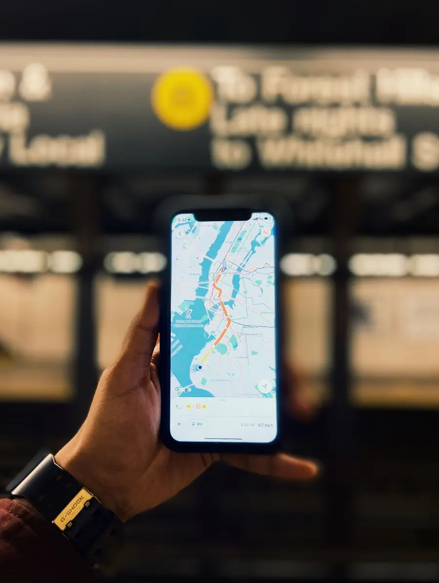 A phone showing Google Maps across Hoboken, North Bergen and New York